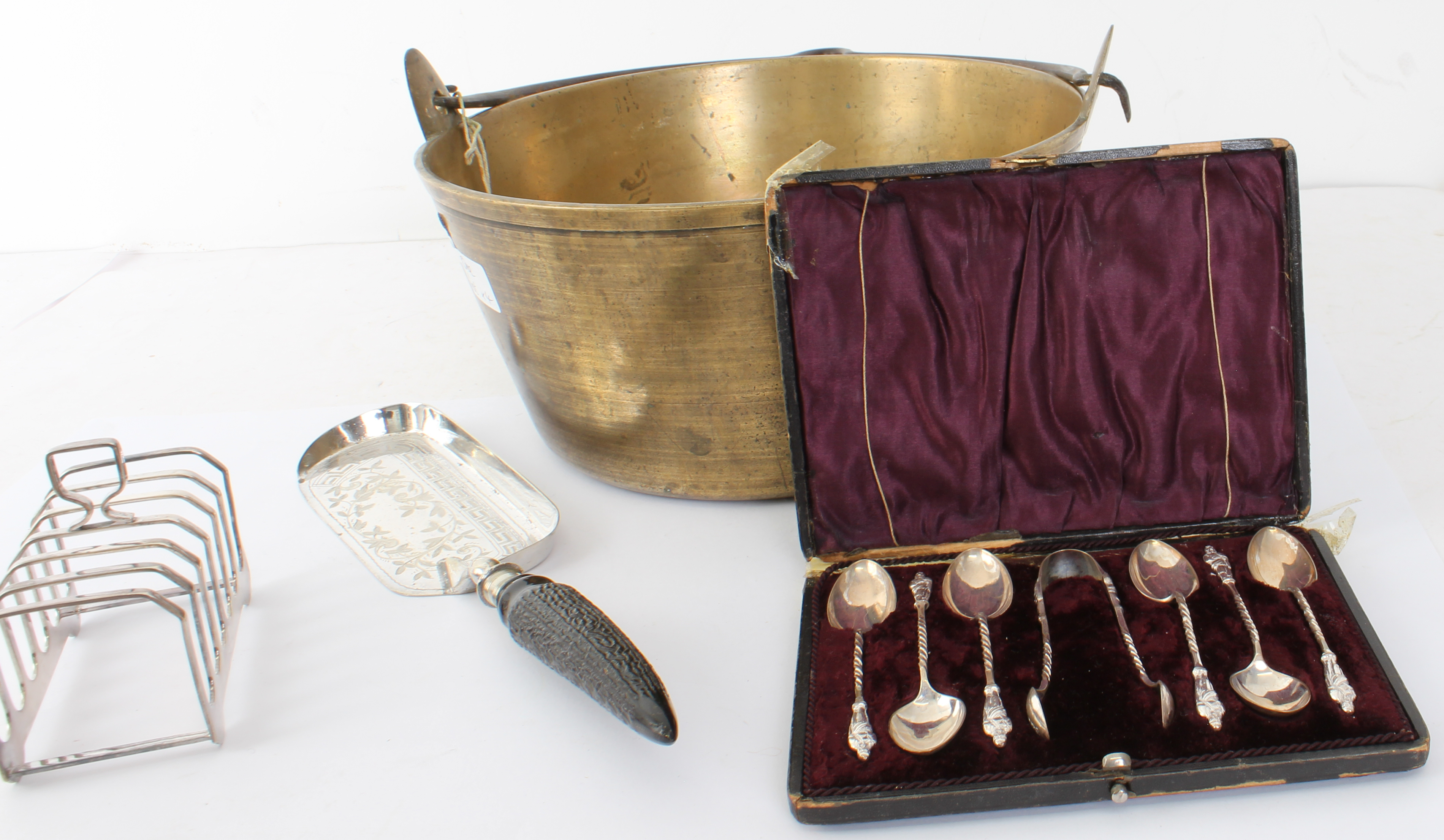 An early 20th century brass preserve pan with swing-handle, together with a set of six cased