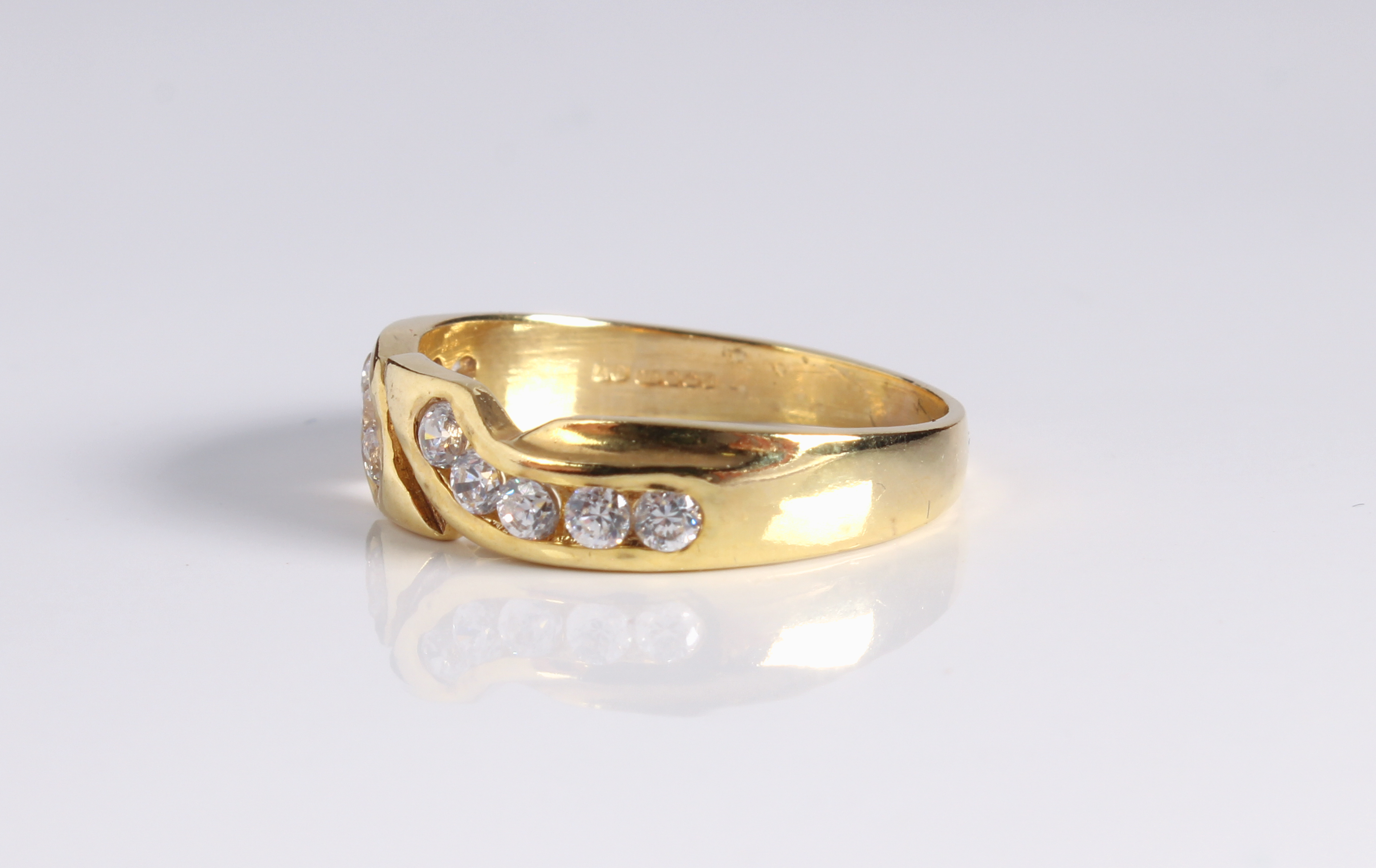 A 9ct yellow gold and white sapphire crossover ring - hallmarked Sheffield 2003, the twist setting - Image 3 of 3