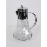 A large silver-plated glass wine jug with interior glass removable ice compartment marked Asprey.