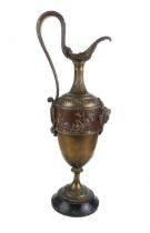 A 19th century brass and copper ewer in high Italian Renaissance style: high arched strap handle