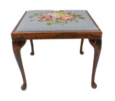 A 1930s stained-wood stool with floral gros point drop-in seat and raised on slender cabriole legs