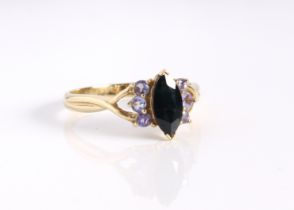 A 10ct yellow gold, sapphire and pale Tanzanite ring - stamped '10K', the central marquise cut