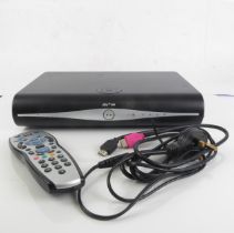 A Sky + HD DRX890WL digibox digital set-top box - with remote control, power cable and HDMI cable.