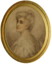 Pre-Raphaelite School (late 19th century) Portrait of a lady oval, charcoal and red chalk, signed