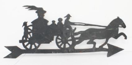 An antique wrought iron weather pierced vane modelled as a horse and carriage with various