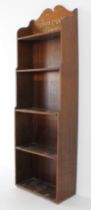 A French early 20th century oak bookcase of slim proportions: galleried top with the François