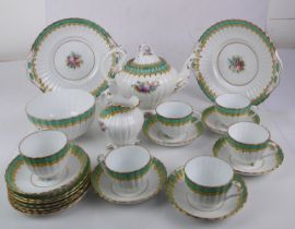 A 19th century hand-painted tea set comprising teapot, milk jug, sugar bowl, two cake plates and six