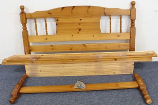 A turned pine double bed frame