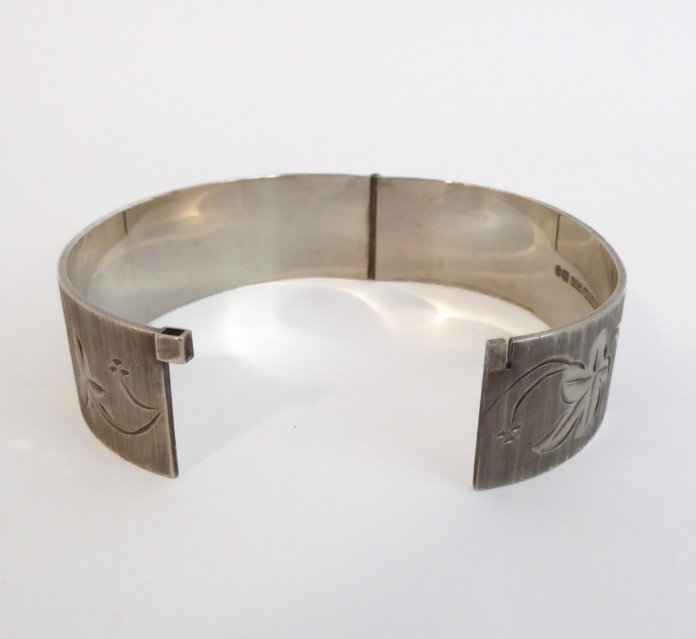 A heavy silver bangle with hallmarks for Birmingham 1970. - Image 4 of 4