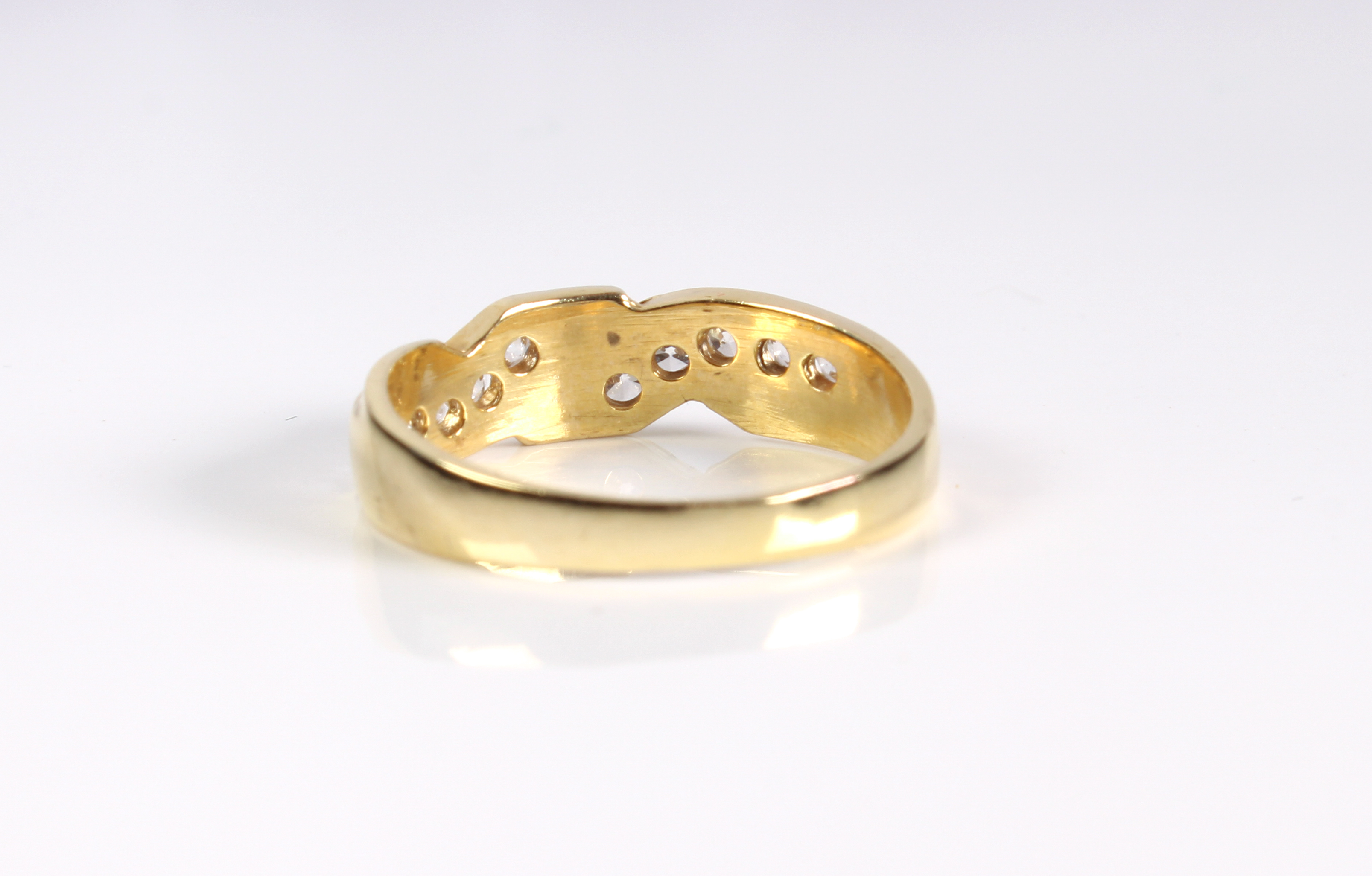A 9ct yellow gold and white sapphire crossover ring - hallmarked Sheffield 2003, the twist setting - Image 2 of 3
