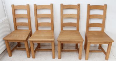 A set of four heavy natural beech ladderback-style kitchen chairs, square legs with H-form