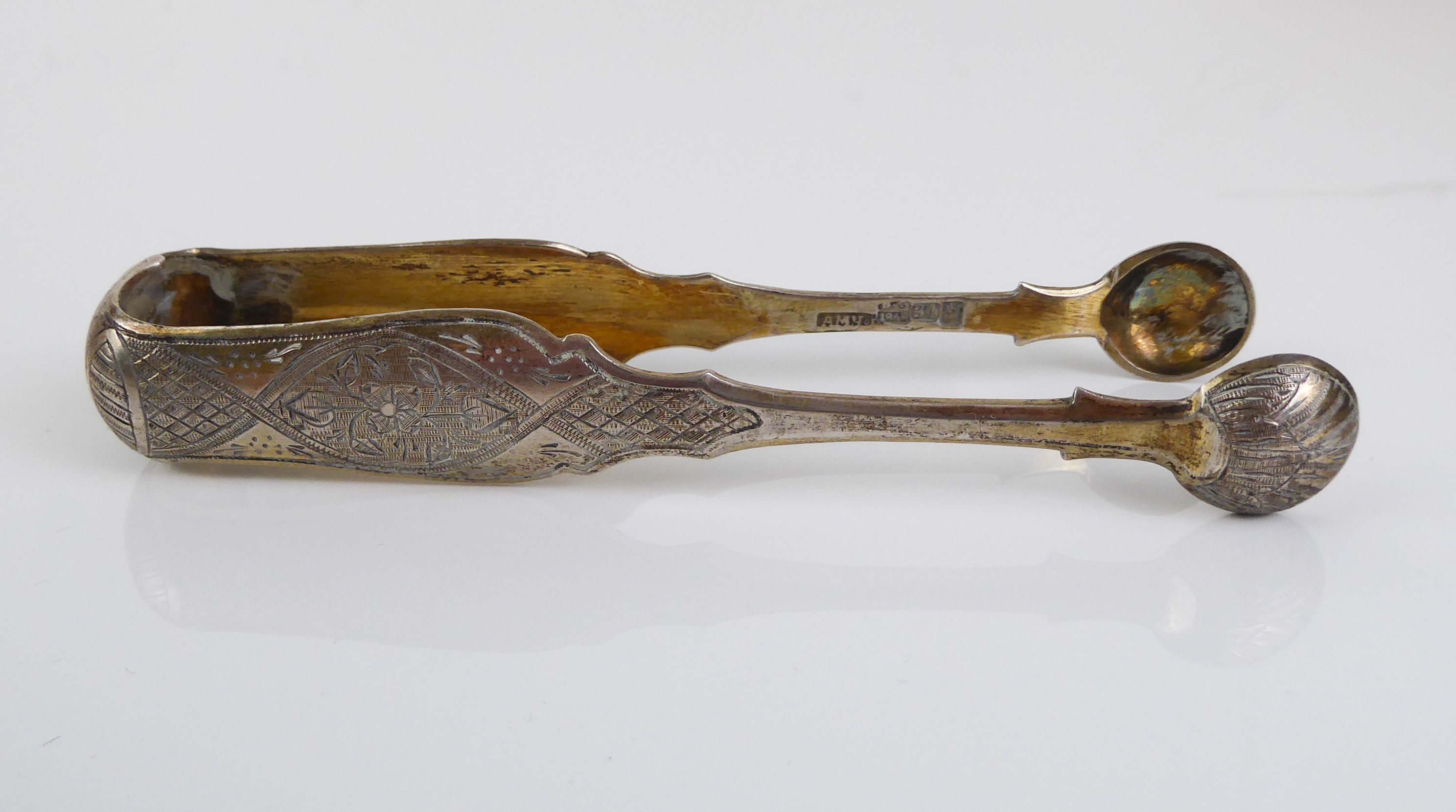 A pair of Russian silver-gilt sugar tongs - assayer Viktor Savinkov, Moscow 1868, with shell bowls - Image 6 of 6