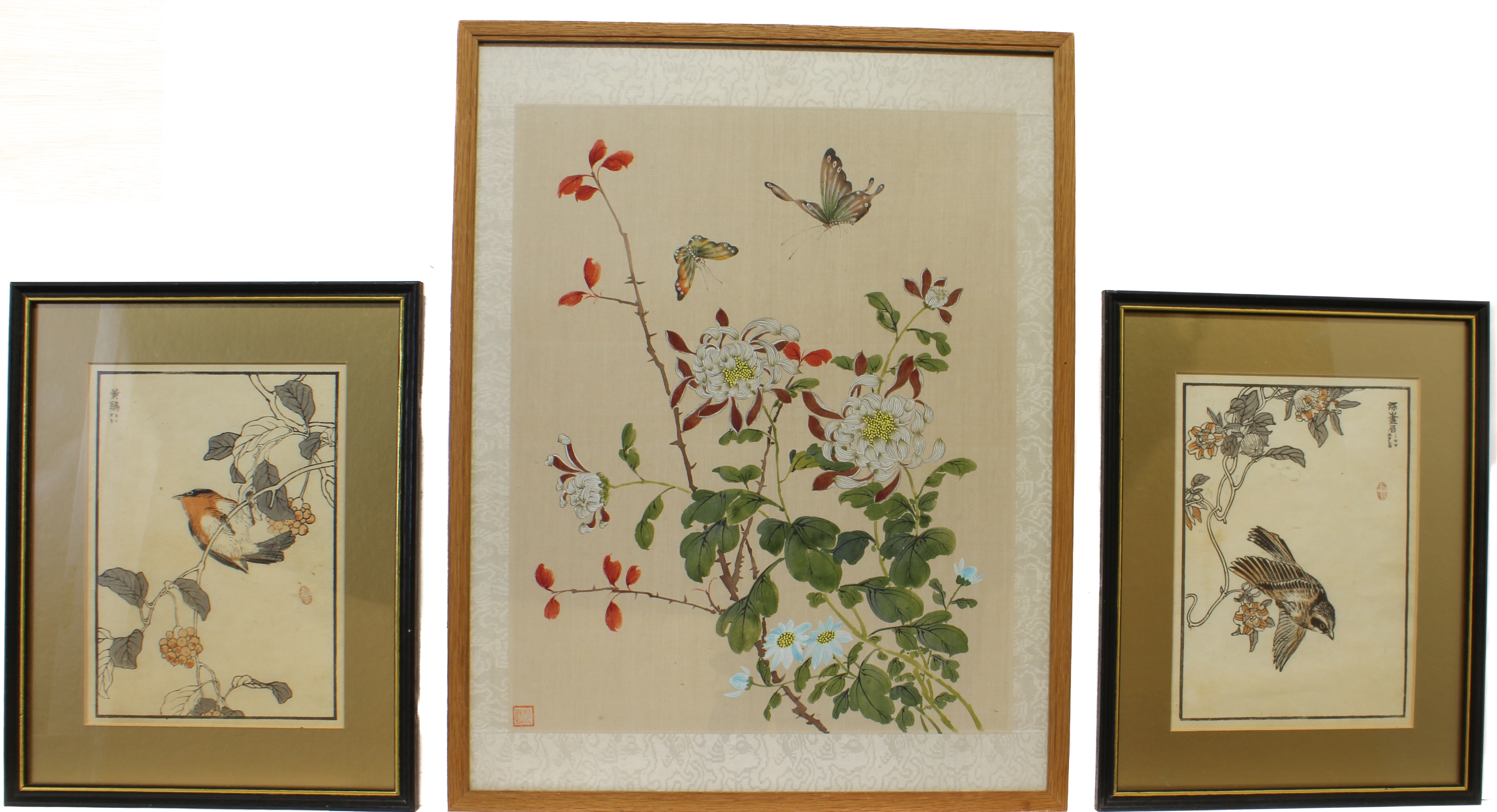 A Chinese watercolour on silk painting of two butterflies above peonies and chrysanthemums -