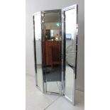 A two-fold steel framed mirror fronted room screen (LH 127 x 180.5 cm).