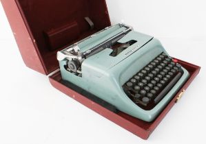 A retro 1950s Olivetti Studio 44 typewriter - in the original red faux-leather case.