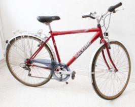 A gentleman's Raleigh Pioneer 120 bicycle with gears and rear rack.