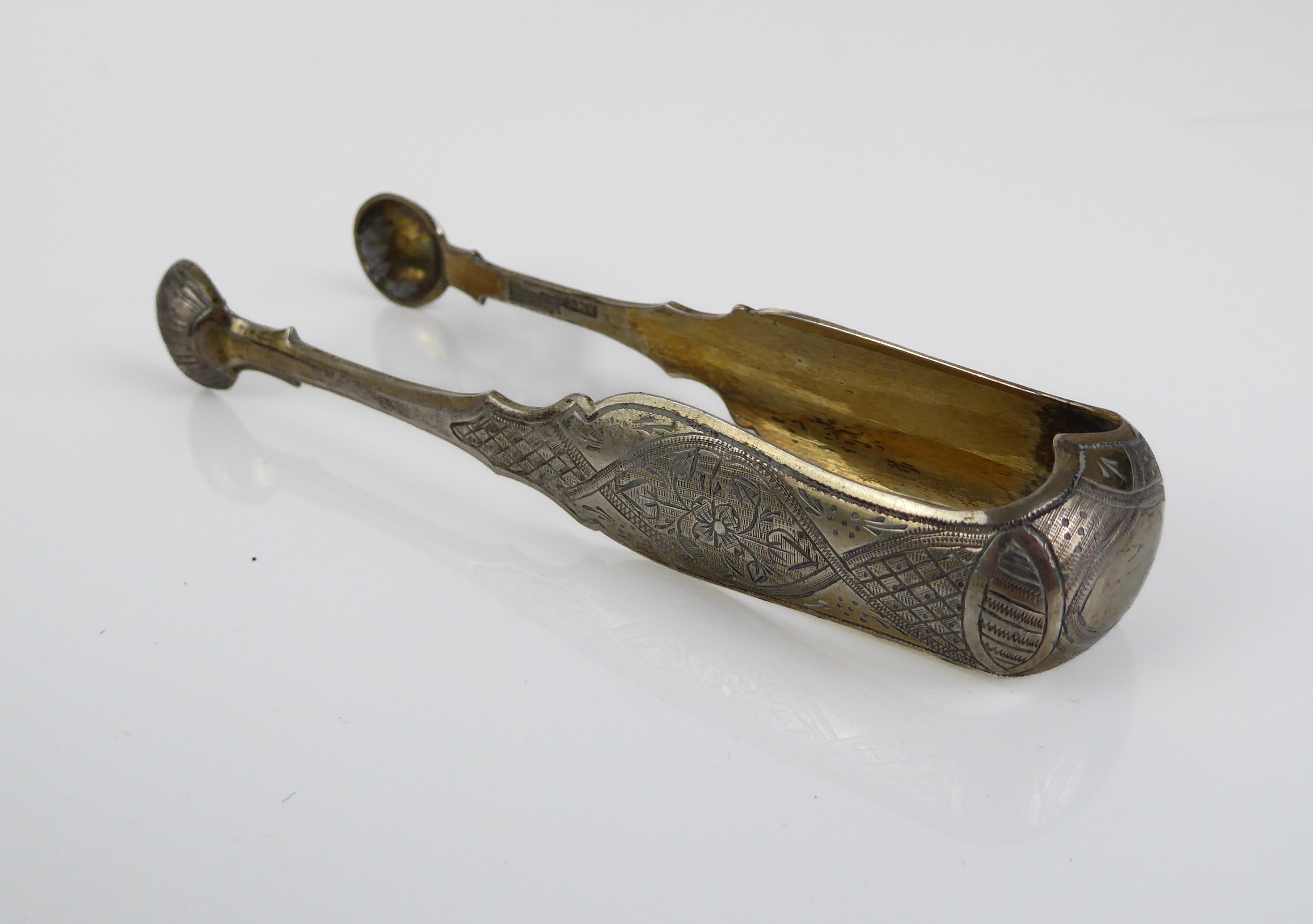 A pair of Russian silver-gilt sugar tongs - assayer Viktor Savinkov, Moscow 1868, with shell bowls - Image 2 of 6