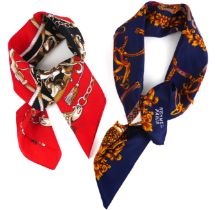 Two Hermès-style scarves - one in dark blue, red and white with gold central foliate rosette and