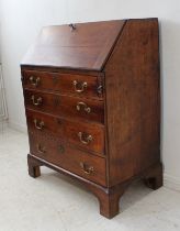 A mid 18th century oak writing bureau of small proportions (the original interior now missing):