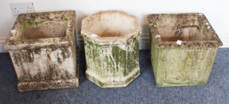 Three composite stone garden planters - one of square, fluted form, one of octagonal fluted form and