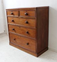 A 19th century mahogany chest: two half-width over three full-width graduated drawers retaining