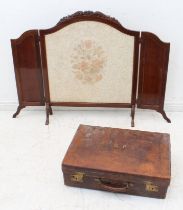 Two pieces: 1. A mahogany folding fire-screen - with carved top and floral decorated material centre