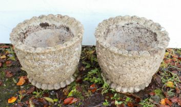 A pair of composition stone planters with crimped rims and feet (29cm. high x 36cm. in diameter)