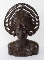 A very finely carved large Balinese/Indonesian bust carving: elaborate pierced headdress, large