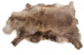 A reindeer hide rug by Hanlin Ltd - medium size, in excellent condition, date stamp to reverse for
