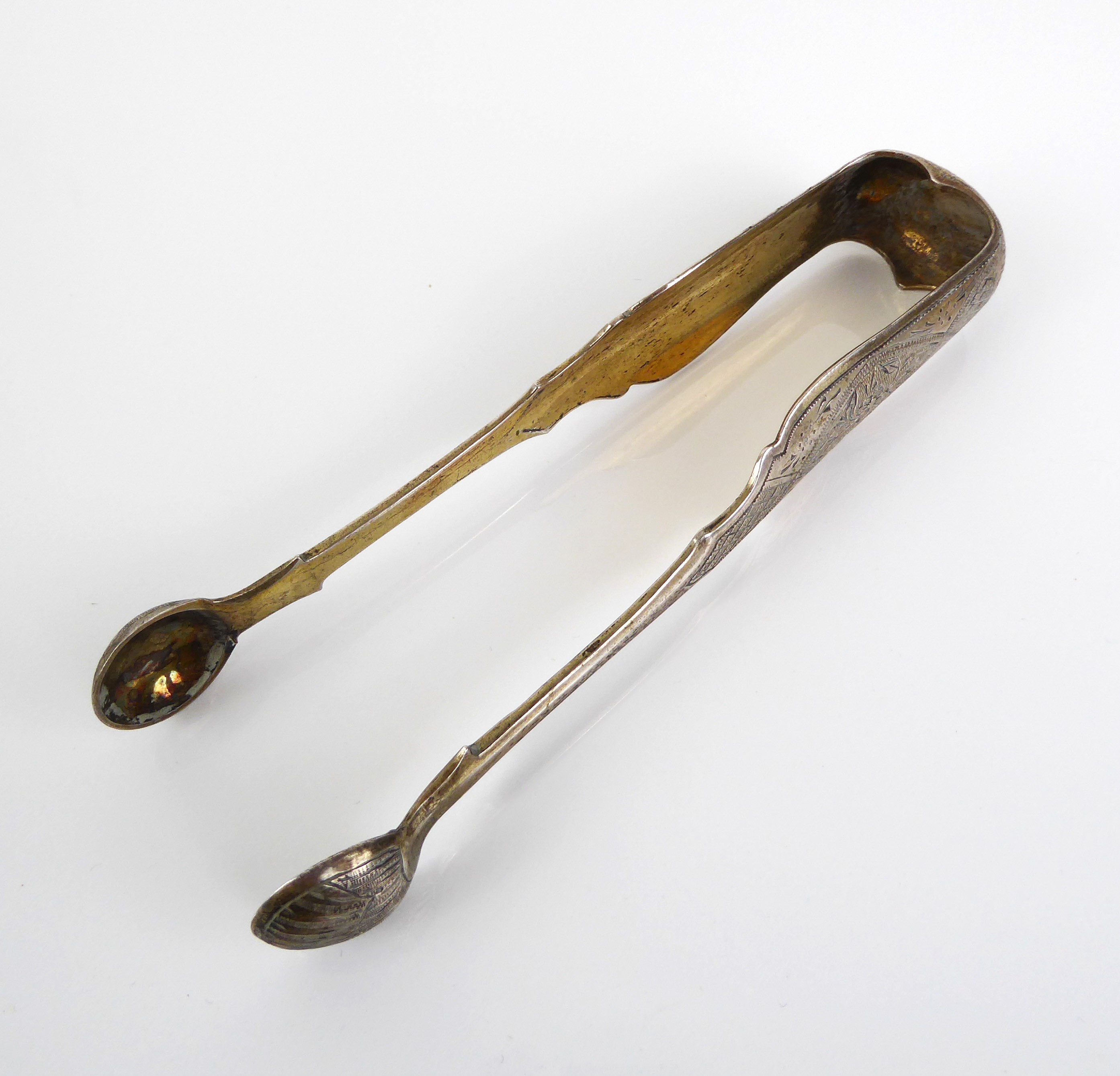 A pair of Russian silver-gilt sugar tongs - assayer Viktor Savinkov, Moscow 1868, with shell bowls - Image 3 of 6