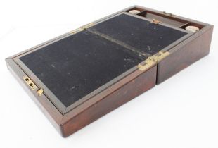 A mid 19th century brass strung rosewood writing slope: usual writing surface and fitted interior