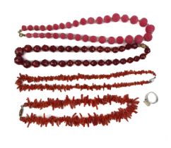 Four vintage necklaces of red coral and carnelian, and a silver ring set with a white stone (5).