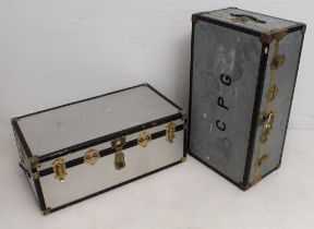 Two vintage brass-bound metal streamer or travel trunks - one with galvanised metal outer, the other