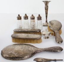 A selection of mostly small silverware to include: a bud vase; a hand-planished/hand-held dressing