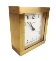 A heavy gilt-brass bedside alarm clock by Tiffany & Co. - with Swiss quartz movement (requires