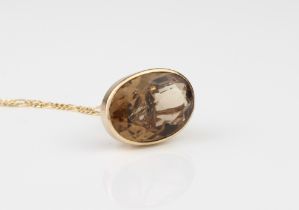 A 9ct yellow gold and smoky quartz fob seal style pendant - hallmarked Birmingham 1986, on a 14ct