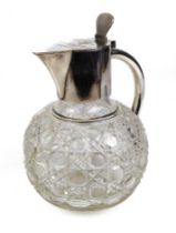 A circa 19th century claret jug with hobnail-cut glass body and silver-plated mounts.