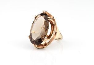 A vintage 9ct gold and smoky quartz ring - hallmarked Birmingham 1974, the large 2.1 x 1.25cm.