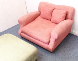 A Loaf Crumpet ‘Love Seat’ and foot stool. The 'Love Seat' upholstered in dark-pink and raised on