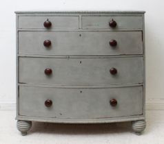 A Victorian grey painted bowfront chest: later painted, the top with applied gadrooned edge