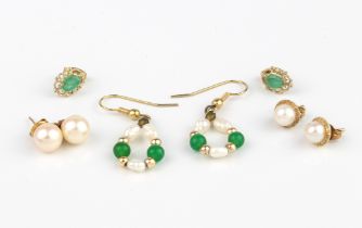 A small collection of 9ct gold earrings - including a pair set with pale emeralds; a pair of rice