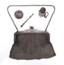 A Victorian silver evening purse - import marks for Birmingham 1863, the mesh bag with angular