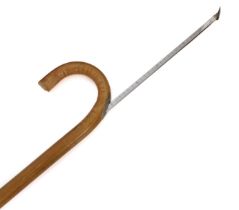 A bamboo horse measuring stick (hands and centimetres) and with spirit level to the cross-bar