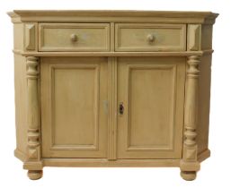 A painted pine corner cabinet: in distressed 'sand yellow', with two drawers over a pair of panelled