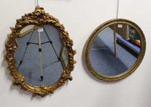 Two late 20th century mirrors: 1.  Rococo-style with gold-painted moulded plaster frame decorated