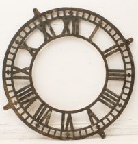 A large antique cast iron turret clock dial - early to mid-20th century, with skeletonised Roman