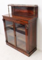 A late Regency rosewood chiffonier - the panelled top with single shelf with gilt brass lancet