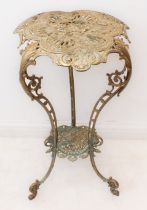 A belle epoque style brass lamp table: late 20th century, the floral and sunburst decorated top