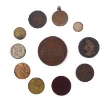 A mixed lot of coins and tokens to include: William III brass guinea weight 1816 George III shilling