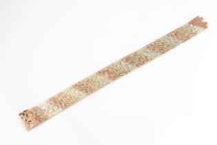 A vintage three-colour 9ct gold articulated link bracelet - hallmarked London 1970, 18.7cm. long,